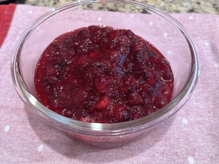 Bowl of homemade cranberry sauce with orange