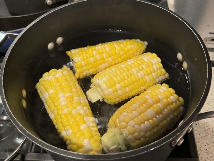 Corn on the cob in hot water